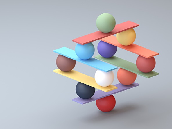 coloured balls balancing in a jenga structure